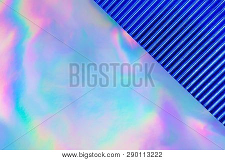 Abstract Modern Holographic Background With Blue Metallized Corrugated Paper. Synthwave. Vaporwave S