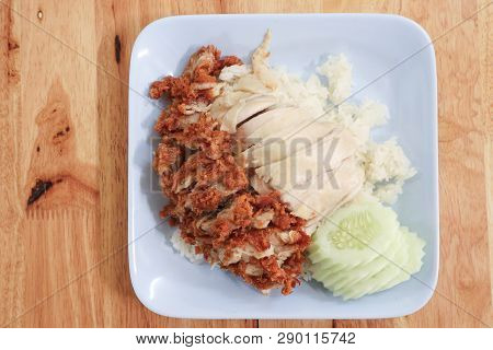 Hainanese Chicken Rice With Roasted Chicken On Wooden Table.hainanese Chicken Rice Is A Dish Of Poac