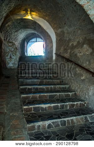 View Of Old Palanok Castle Or Mukachevo Castle, Ukraine, Built In 14th Century. Stone Staircase.