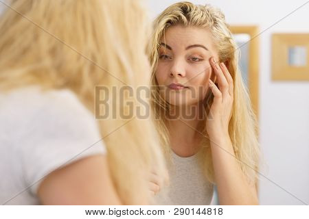 Young Blonde Female Feeling Dull And Tired After Waking Up. Woman Yawning Being Sleepy In Bathroom.