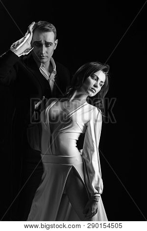 A Turbulent Romance. Couple In Love With Mime Makeup. Theatre Actors Miming Through Body Motions. Mi