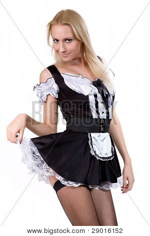 beautiful blonde in a dress of the parlourmaid. Isolated on white