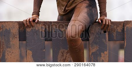 Mud Race Runners Running Over Obstacles Extreme Sport