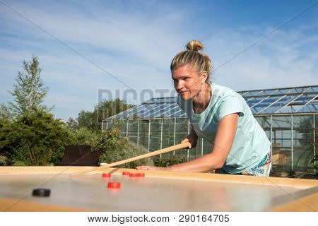 Women Playing Novuss In Outdoors. Novuss Is A National Sport In Latvia Similar To Pocket Billiards O
