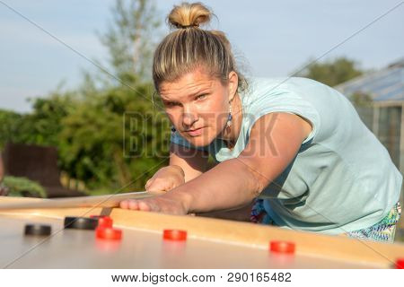 Women Playing Novuss In Outdoors. Novuss Is A National Sport In Latvia Similar To Pocket Billiards O