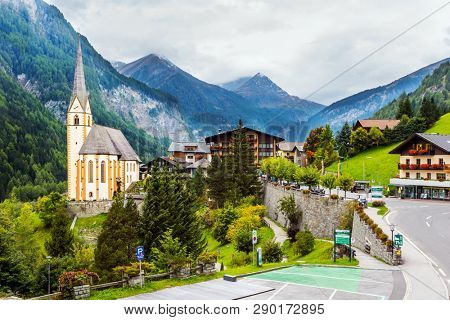 Gothic church of St. Vincenzo. The beginning of the road Grossglocknerstrasse. Heiligenblut - a beautiful village in the Alps. The concept of ecological, historical and phototourism