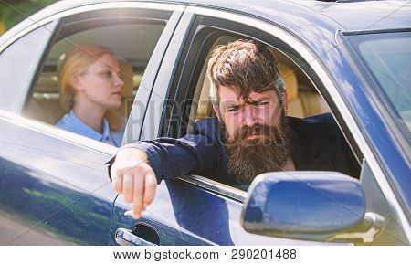 Business Woman Sit On Backseat While Bearded Driver Sit In Front. Car With Open Windows And Passenge
