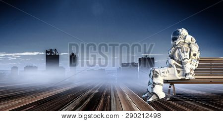Rocketman on bench. Mixed media