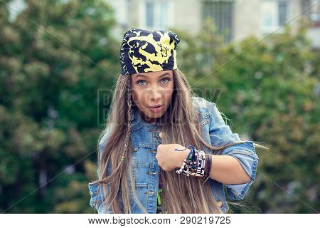 Young Amazed Pretty Woman In Bandana Looking At Camera In Surprise Of Being Selected