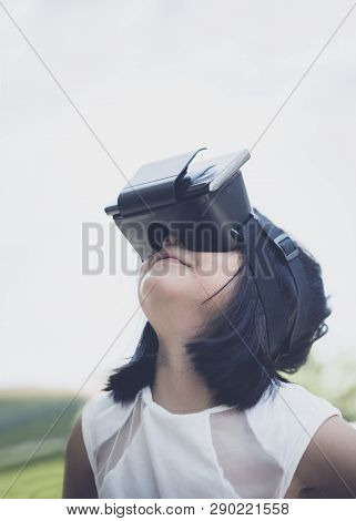 Children Wearing Virtual Glasses And Watching Content In Side Standing Outdoor