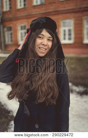 Portrait Of A City Girl In A Blue Jacket. Girl Walking In The Fresh Air