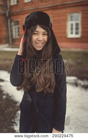 Portrait Of A City Girl In A Blue Jacket. Girl Walking In The Fresh Air