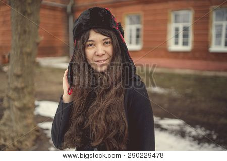 Portrait Of A City Girl In A Blue Jacket. Girl Walking In The Fresh Air