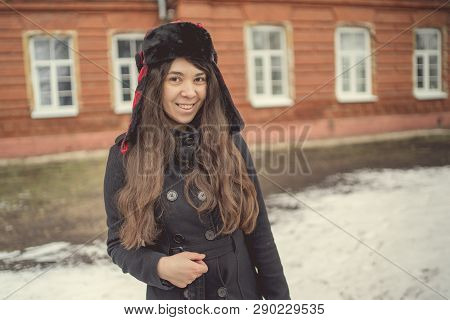 Portrait Of A City Girl In A Blue Jacket. Girl Walking In The Fresh Air