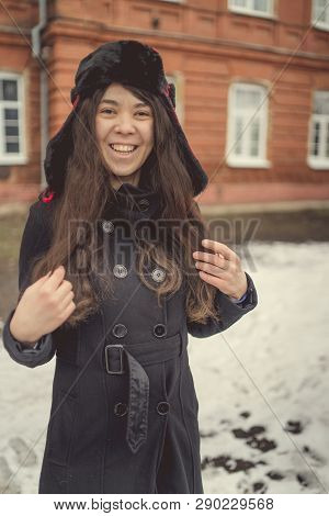 Portrait Of A City Girl In A Blue Jacket. Girl Walking In The Fresh Air