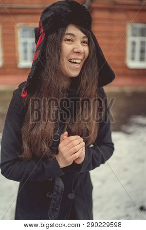 Portrait Of A City Girl In A Blue Jacket. Girl Walking In The Fresh Air