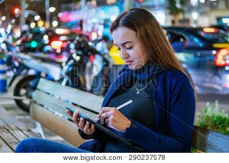 Woman Drawing On Digital Tablet With Stylus Pencil.