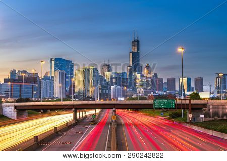 Chicago, Illinois, USA downtown skyline over highways at twilight. 