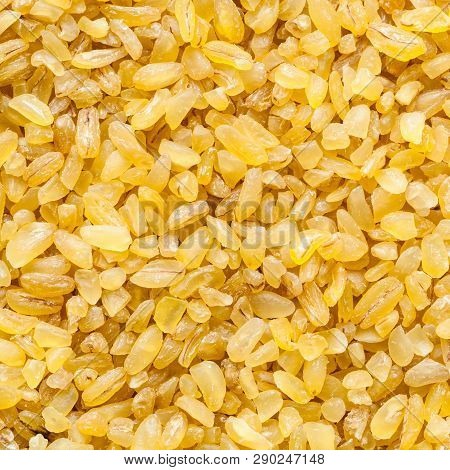 Food Square Background - Bulgur (burghul) Groats, Parboiled, Dried And Crushed Wheat Grains Close Up