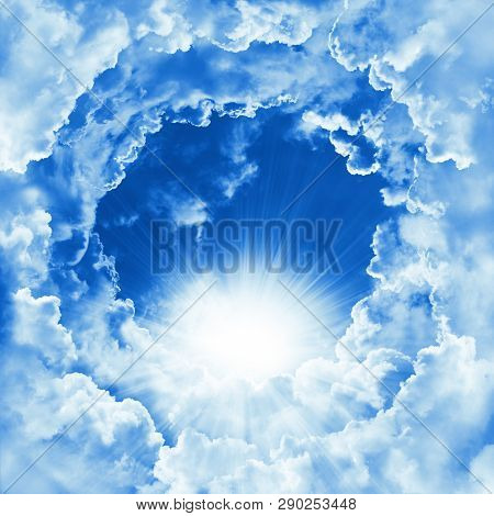 Religion Concept Of Heavenly Background. Divine Shining Heaven With Dramatic Clouds, Light. Sky With