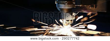 Sparks Fly Out Machine Head For Metal Processing Laser Metal On Metallurgical Plant Background. Manu
