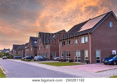 Street With Modern Family Houses In Urban Suburb In The Netherlands