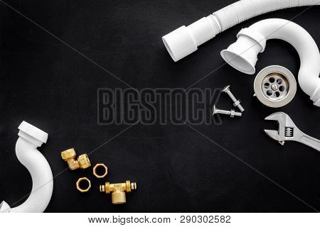 Plumber Profession With Gear And Instruments For Repair Tubes On Black Background Top View Copyspace