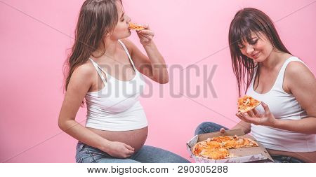 Nutrition Concept, Pregnant Women Eating Pizza On A Pink Background