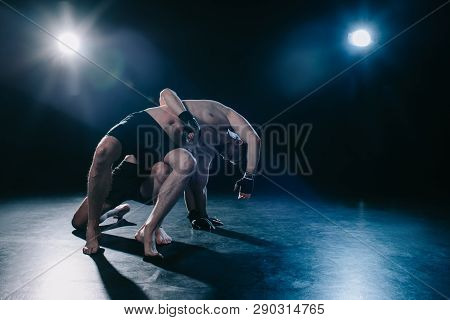 Mma Fighter Doing Clinch To Another Sportsman Behind Back During Wrestling Training