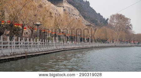 The Walk Way Along And The Bridge With The Chinese Style At The Longmen Grottoes. The Longmen Grotto