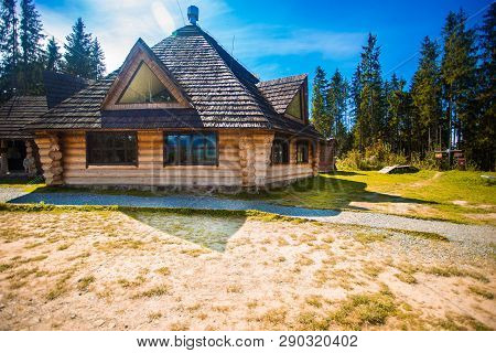 Ethno Old Wooden House In Mountains Forest Village. House Made Of Natural Materials. Old Deserted Wo