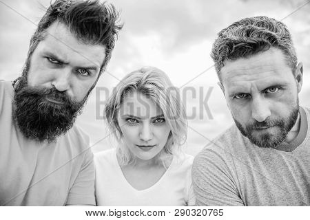 Suspicious Look. Threesome Suspiciously Look Down. Woman And Men Look Confident Sky Background. Stre