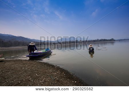 Villagers Are Catching Fish By Fish Trap (net Trap) In Reservoir