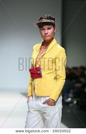 ZAGREB, CROATIA - NOVEMBER 25: Fashion model wears clothes made by Nino Bollag on 'Fashion Week Zagreb' show on November 25, 2011 in Zagreb, Croatia.