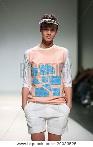 ZAGREB, CROATIA - NOVEMBER 25: Fashion model wears clothes made by Nino Bollag on 'Fashion Week Zagreb' show on November 25, 2011 in Zagreb, Croatia.