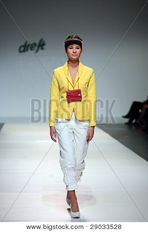 ZAGREB, CROATIA - NOVEMBER 25: Fashion model wears clothes made by Nino Bollag on 'Fashion Week Zagreb' show on November 25, 2011 in Zagreb, Croatia.