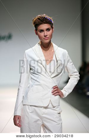 ZAGREB, CROATIA - NOVEMBER 25: Fashion model wears clothes made by Nino Bollag on 'Fashion Week Zagreb' show on November 25, 2011 in Zagreb, Croatia.