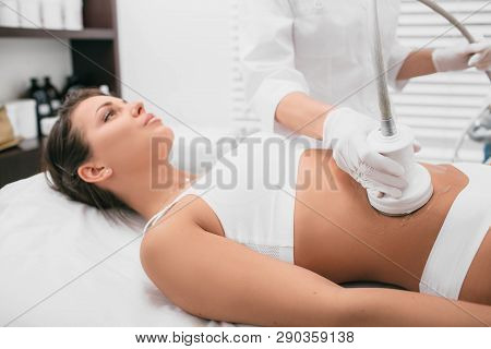 Procedure Removing Cellulite On Female Abdomen, Cavitation Belly Massage