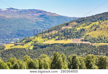 Mountains And Agricultural Area Near The Norwegian Town Oppdal