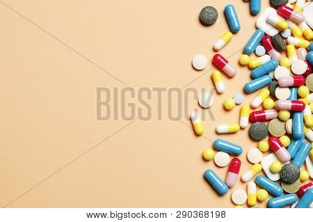 Multi-colored Vitamins On A Pink Background. Place For Text. Top View.