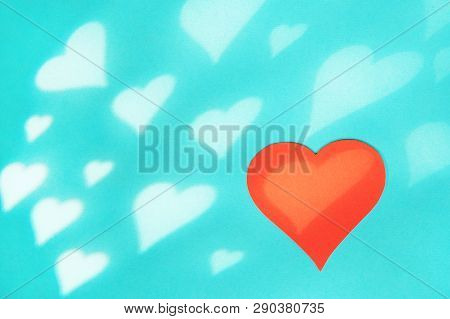 Blue Background With Red Hearts. Gobo Mask Light Effect In The Shape Of A Heart.