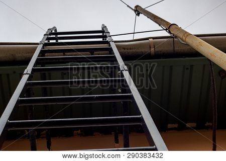Staircase To The Roof Close Up On Sky Background