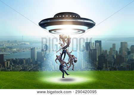 Flying saucer abducting young businessman 