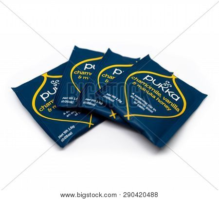 Packets Of Pukka Tea Are Displayed On A White Background