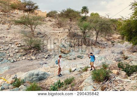 Muscat, Oman - December 16, 2018: Tourists Take Pictures In The Wadi - Dry Riverbed - On The Outskir