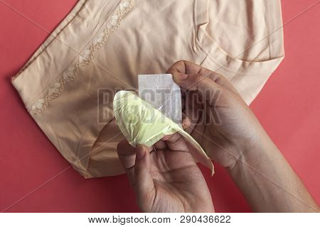 Pants And Women Opening Menstruation Sanitary Pads For Hygiene Protection. Protection For Woman Crit