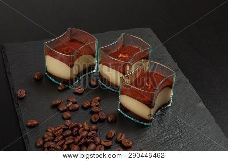 Mini Dessert Tiramisu  On Dark Background. Tasty Small Portions Of Exquisite Desserts