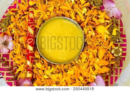 Traditional Haldi Turmeric Kept On A Flower Plate For The Hindu Marriage Ceremony