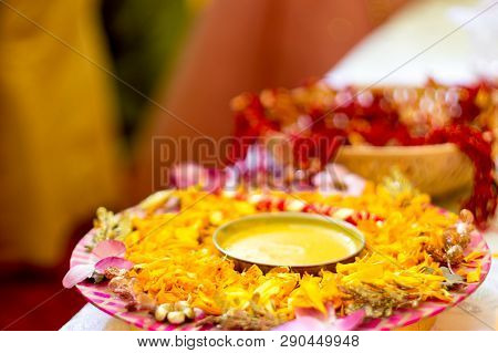 Traditional Haldi Turmeric Kept On A Flower Plate For The Hindu Marriage Ceremony