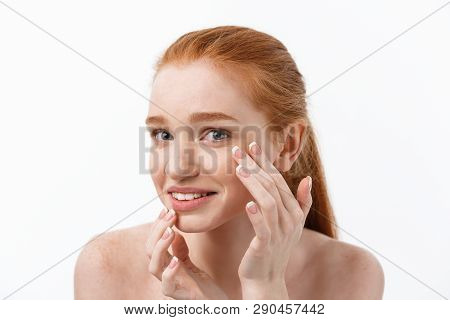 Young Caucsian Woman Squeezes Acne On The Face Of Beauty